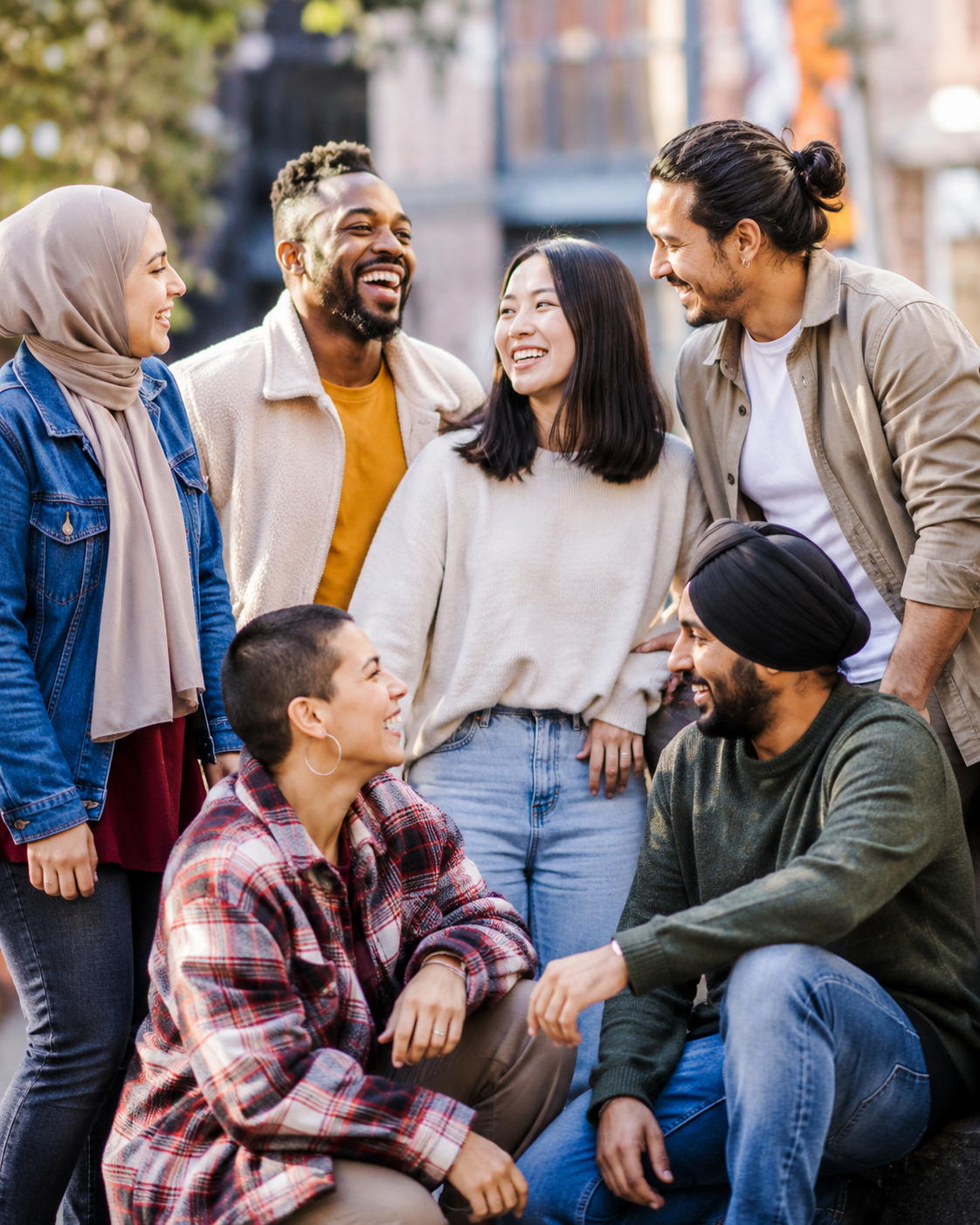 A diverse group of newcomers smiling together